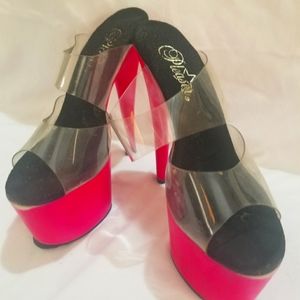 Well used hot pink pleaser heels. Worn condition.